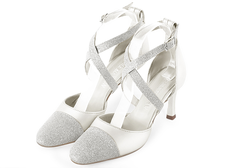 Light silver and pure white women's open side shoes, with crossed straps. Round toe. High slim heel. Front view - Florence KOOIJMAN